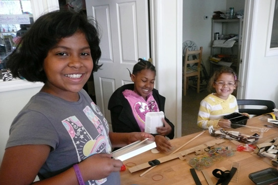 The cast at work designing new instruments.